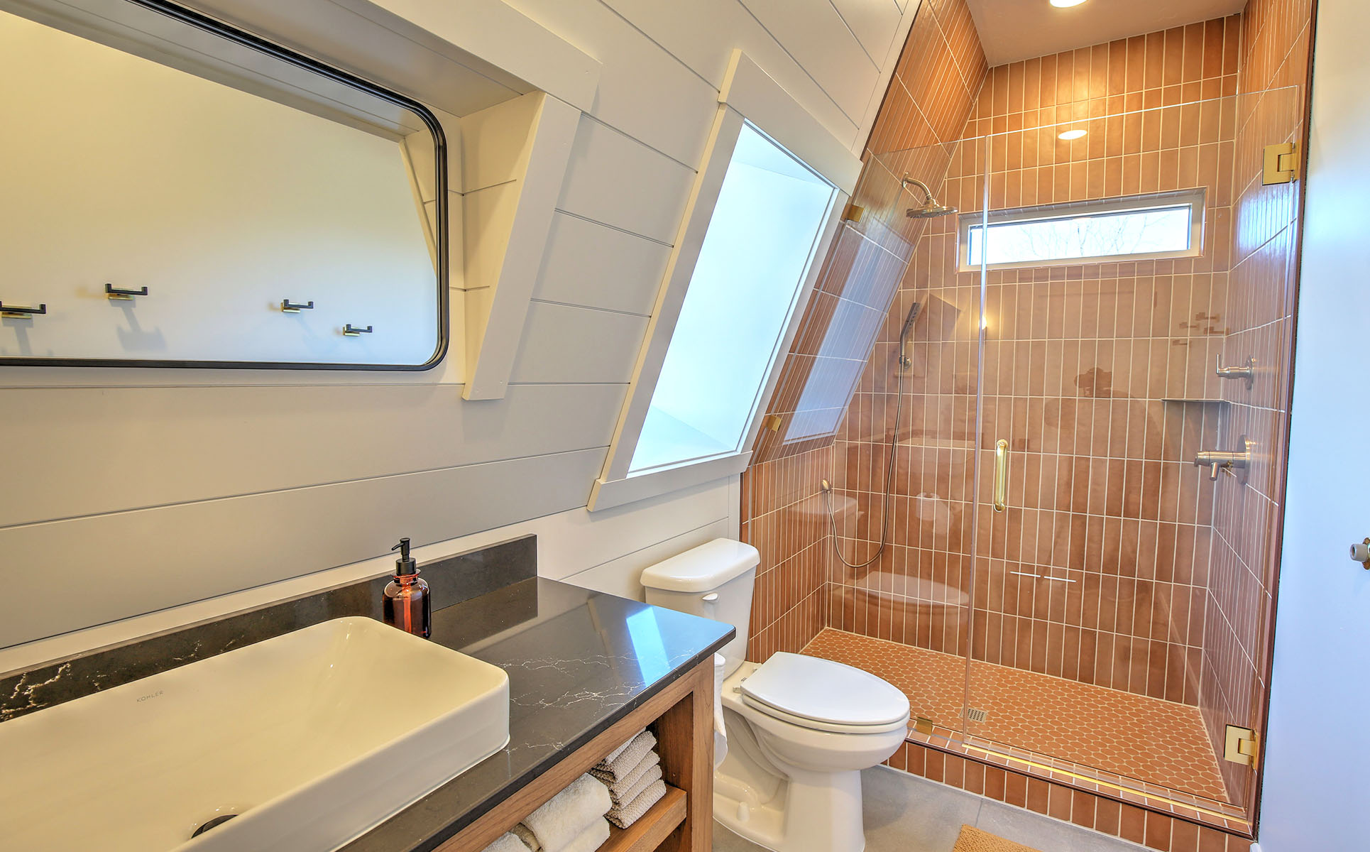 Walk-in shower with red tiles