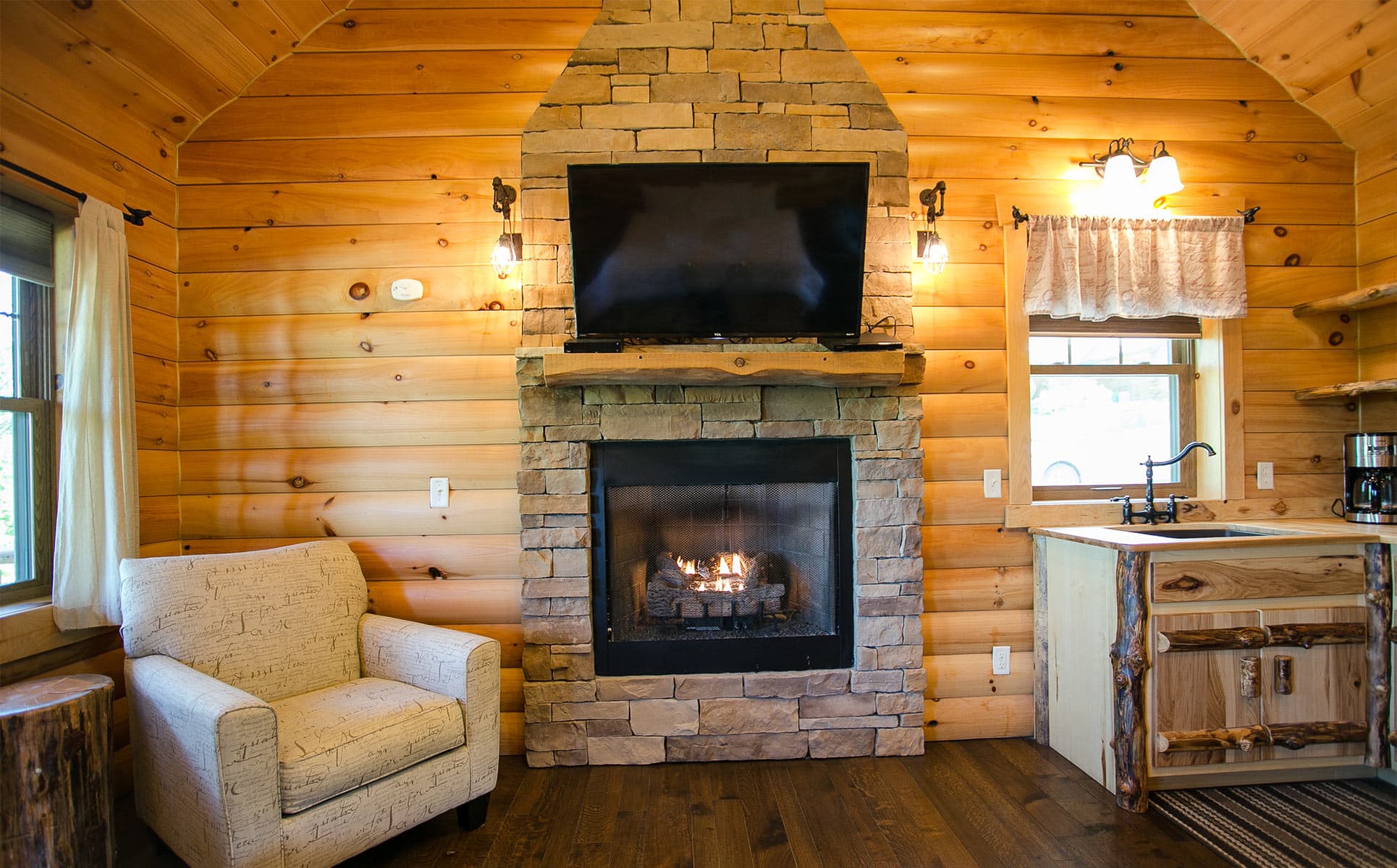 stone fireplace and chair