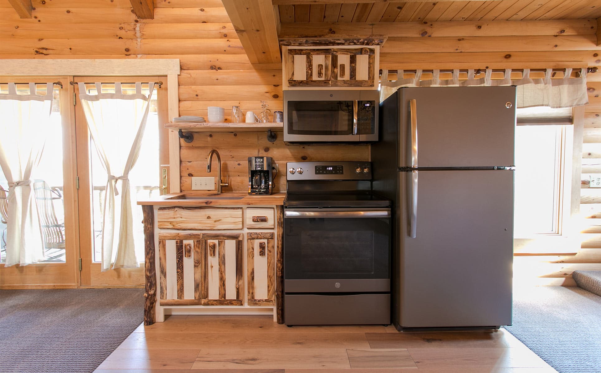 Kitchen with range, micro, and fridge