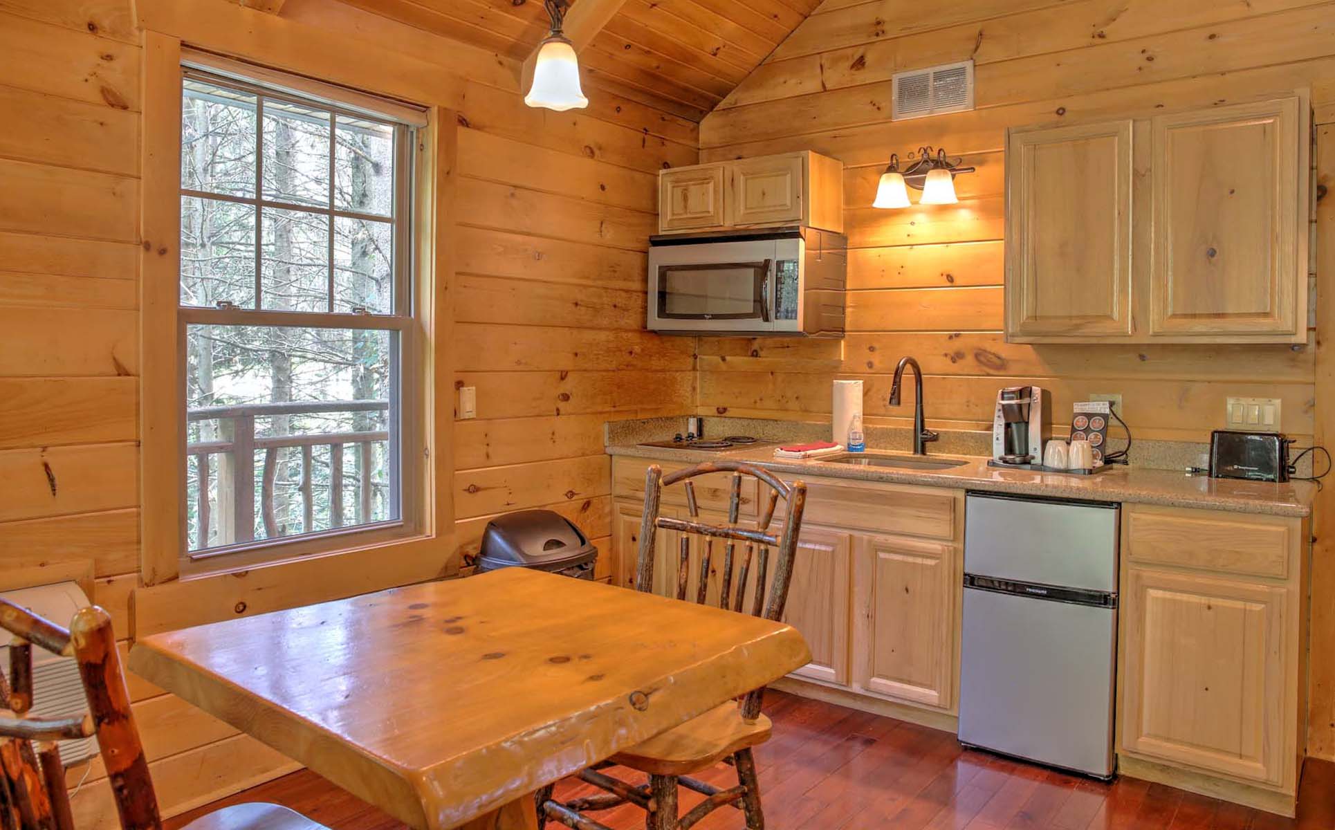 Full Kitchen with dining table and two chairs