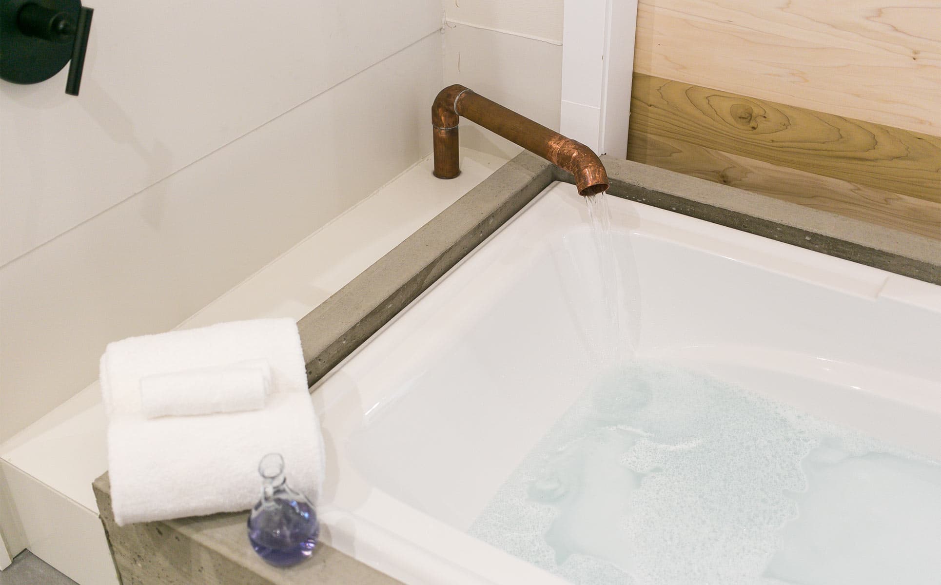 Jetted tub with copper faucet