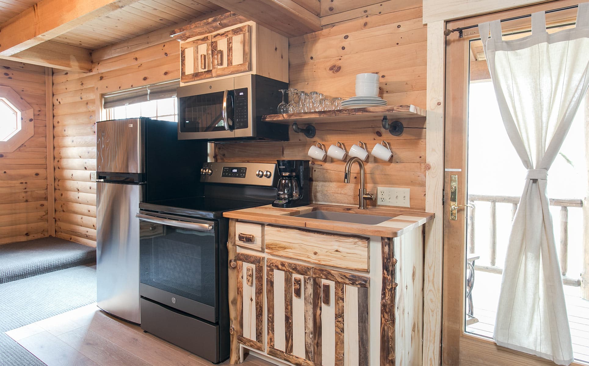 Kitchen with range, micro, and fridge