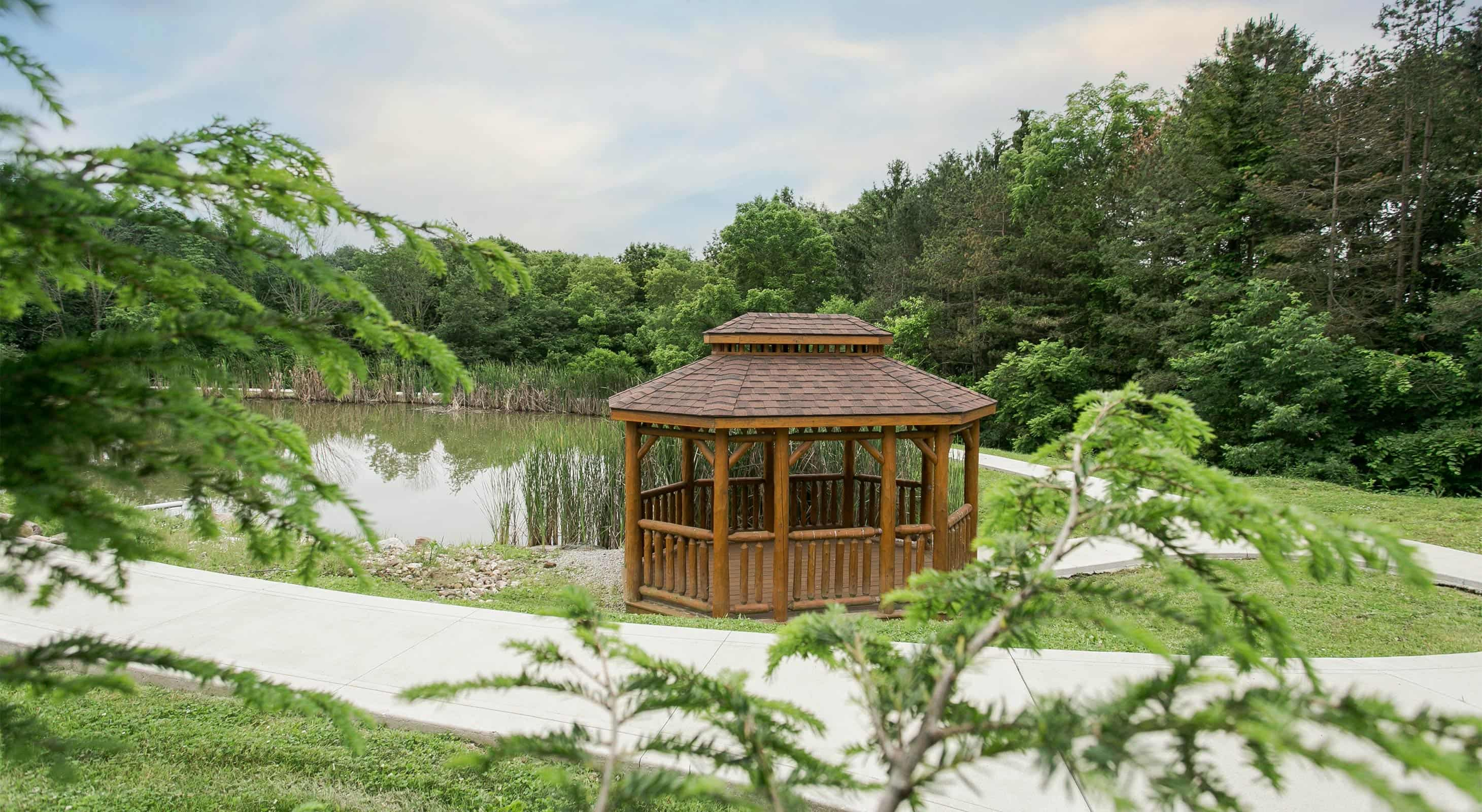 Gazebo in front of Pond at Pine Cove Lodging