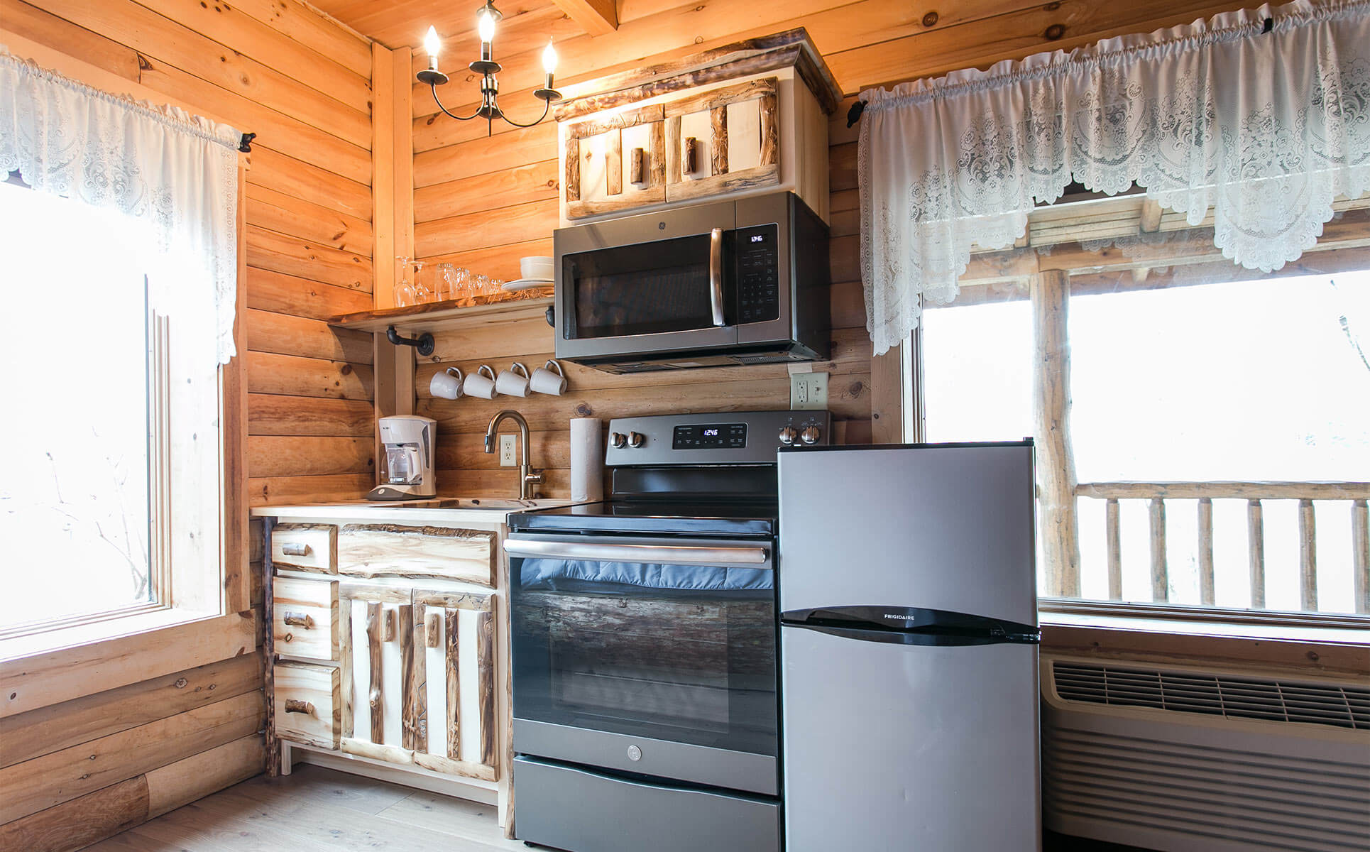 Kitchen with range, microwave, and fridge