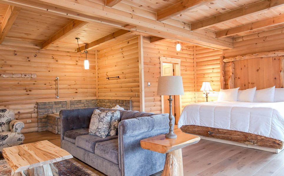 Bed, couch, chair, and tub in Rabbit's Nest Cabin