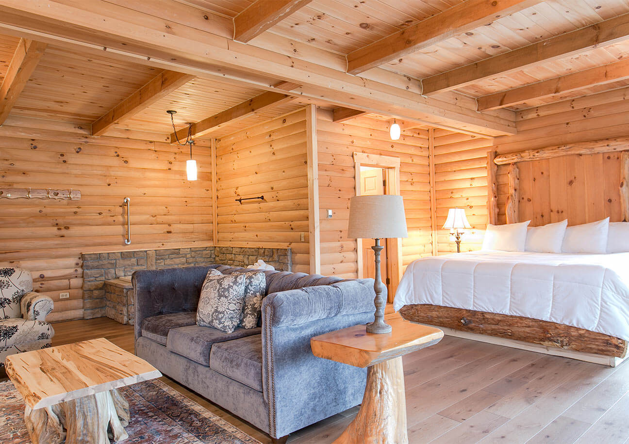 Bed, couch, chair, and tub in Rabbit's Nest Cabin