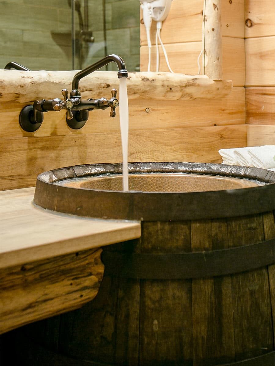 Wine Barrel sink in basement bathroom