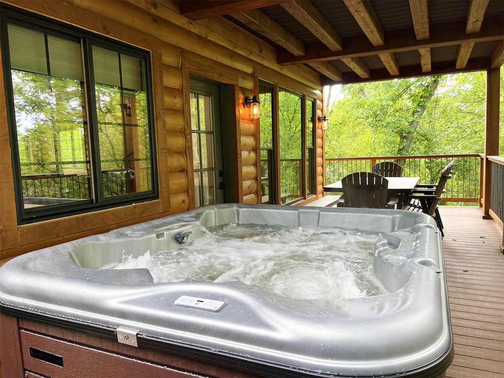 Hot tub on the porch of skyview treehouse