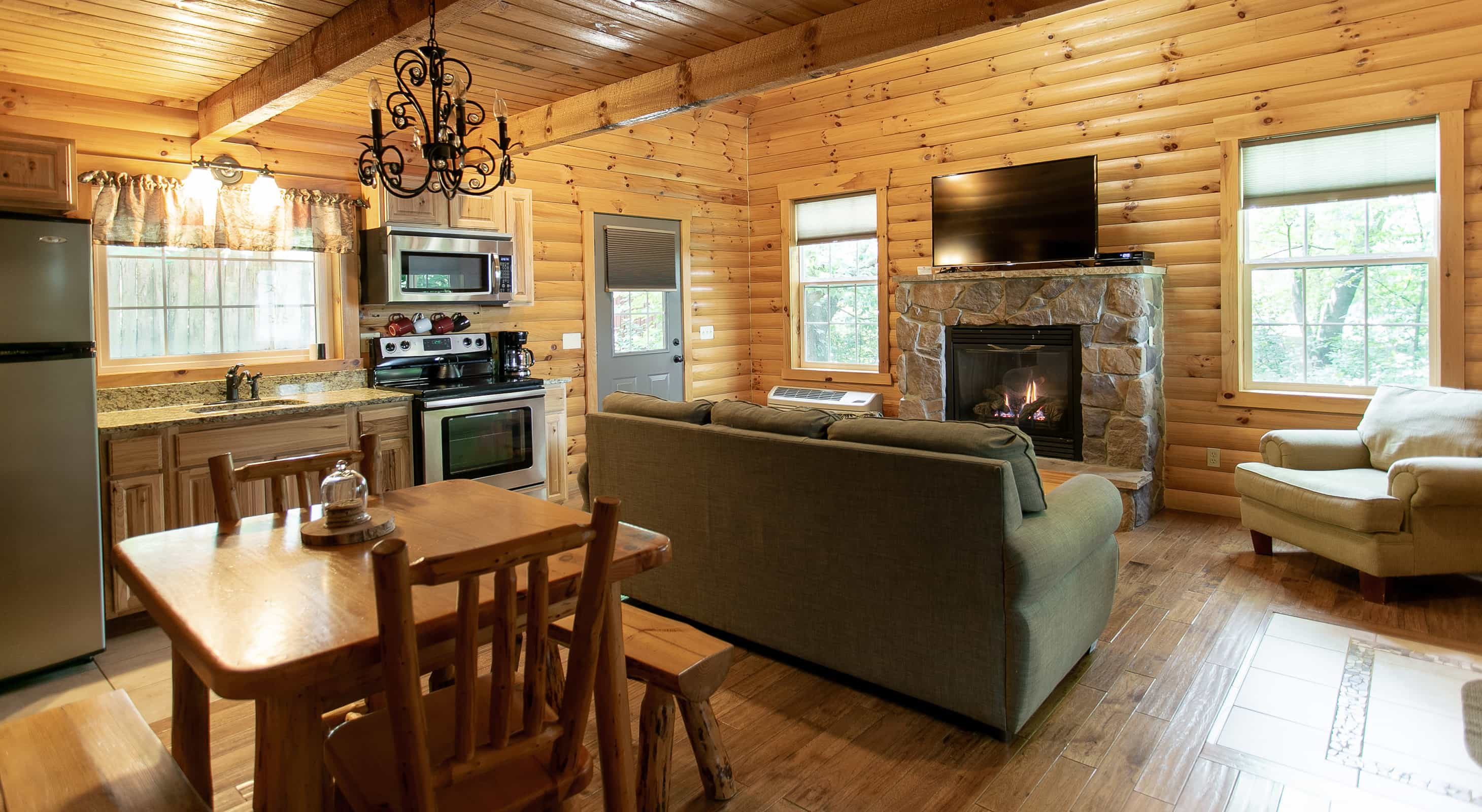 Living room with fireplace in the Sugar Maple Log Cabin