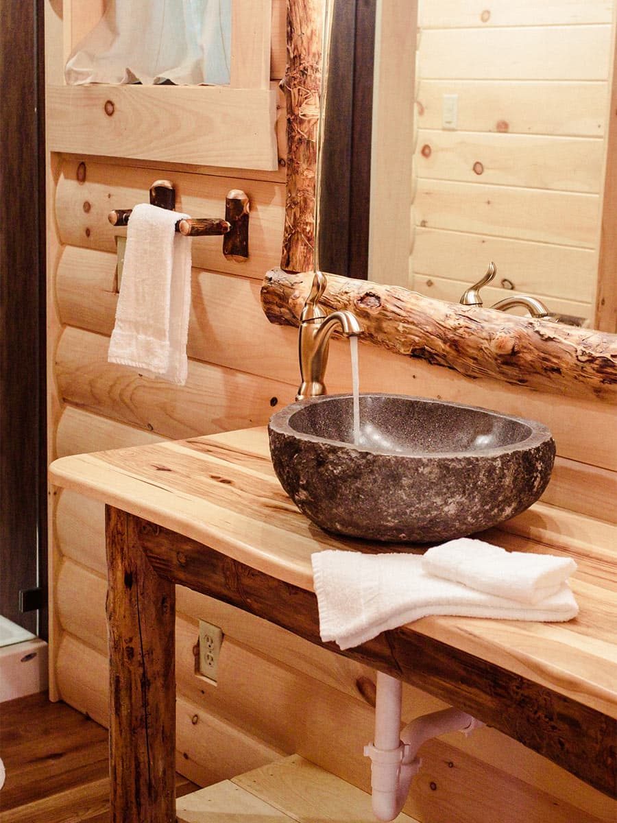 Vessel sink on wood vanity in bathroom