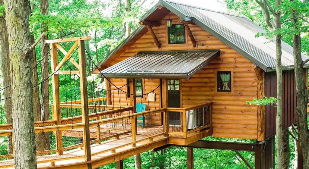 Exterior of treehouse nestled in the trees