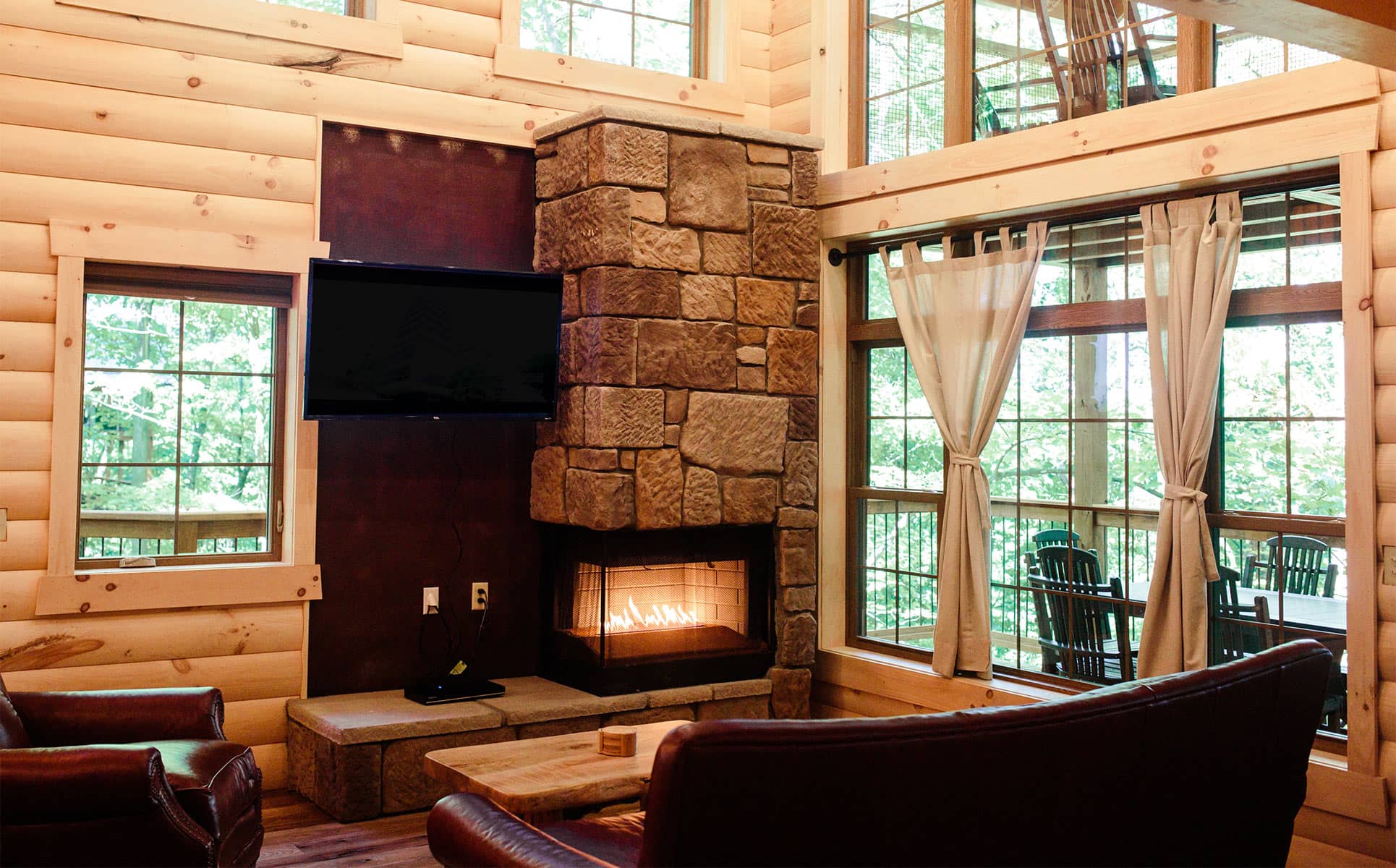 Fireplace, tv,  and tall windows