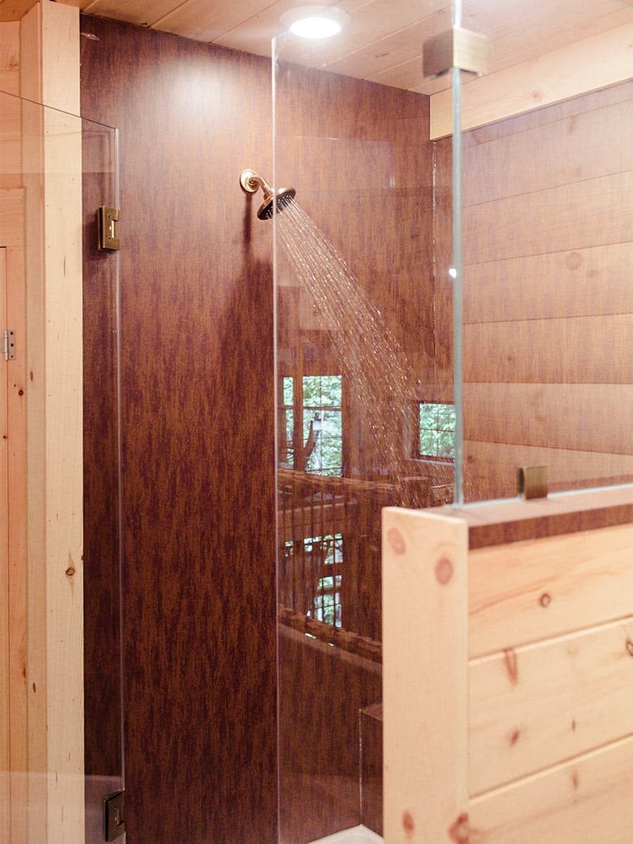 Walk-in shower with red tiles