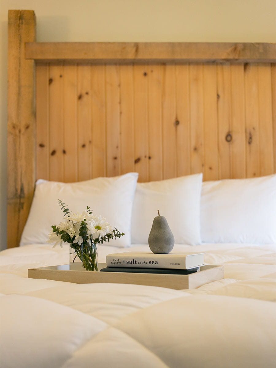 King Bed with flowers and book