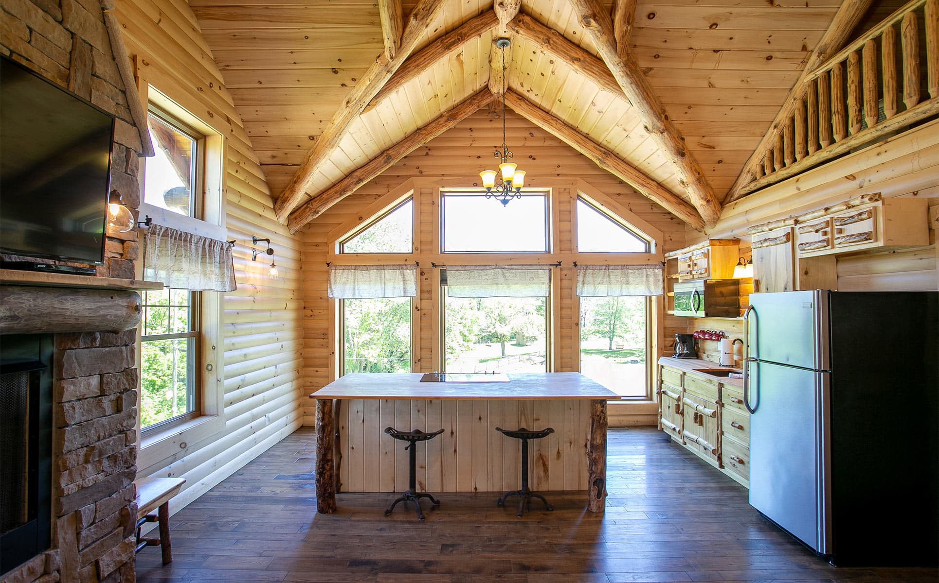 Kitchen area with vaulted ceiling