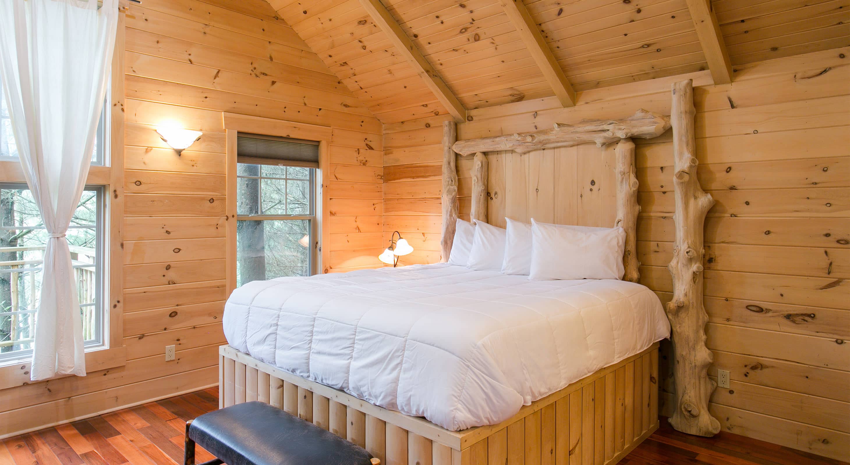 Log Bed in Whispering Pines Treehouse